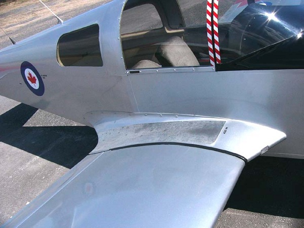  The wing root of a simple aircraft, an American Aviation AA-1 Yankee, showing a wing root fairing. 